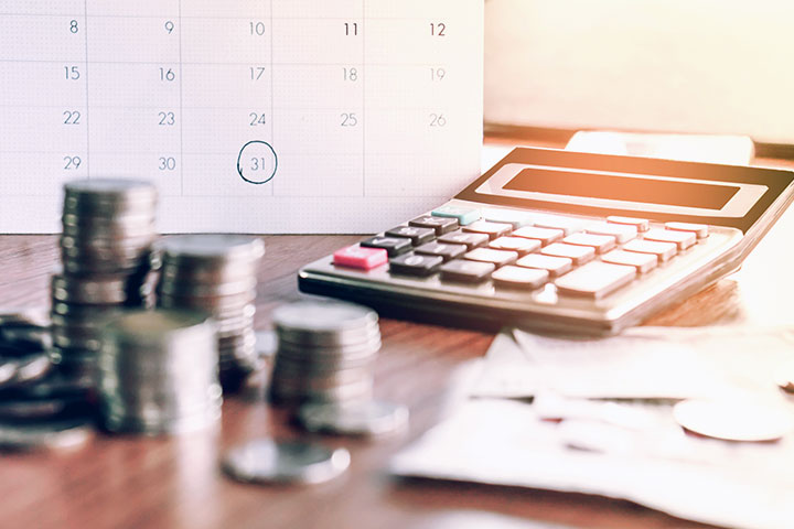 Calculator and documents used as part of taxation advice.